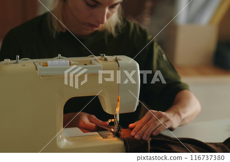 Fashion Designer Working With Sewing Machine Fashion Designer Working With Sewing Machine 116737380