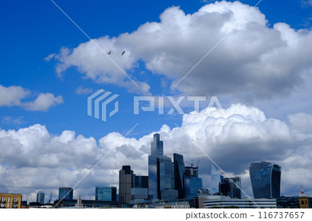 City of London business district Shiny Skyscrapers set against a dramatic stormy sky. City of London business district Shiny Skyscrapers set against a dramatic stormy sky. 116737657