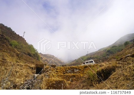 LOW ANGLLE VIEW OF ZIG ZAG ROAD IN SIKKIM 116737849