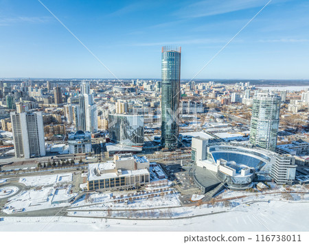 Yekaterinburg city with Buildings of Regional Government and Parliament, Dramatic Theatre, Iset Tower, Yeltsin Center, panoramic view at winter sunset. 116738011