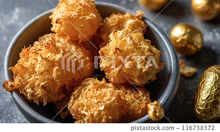 A bowl filled with golden, crispy air fryer delights, perfect for a snack or appetizer. A bowl filled with golden, crispy air fryer delights, perfect for a snack or appetizer. 116738372
