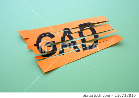 Cut sheet of paper with abbreviation GAD Generalized Anxiety Disorder. 116738810