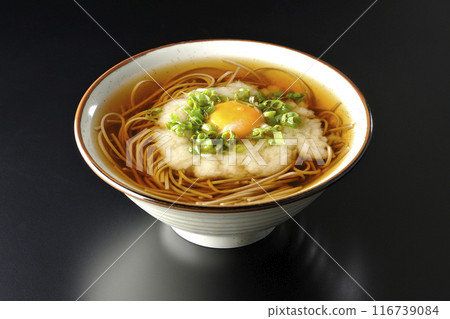 Tsukimi Tororo Soba photographed against a black background Tsukimi Tororo Soba photographed against a black background 116739084
