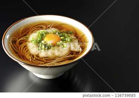 Tsukimi Tororo Soba photographed against a black background 116739085
