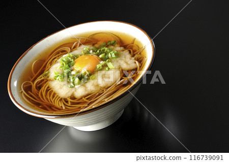 Tsukimi Tororo Soba photographed against a black background Tsukimi Tororo Soba photographed against a black background 116739091