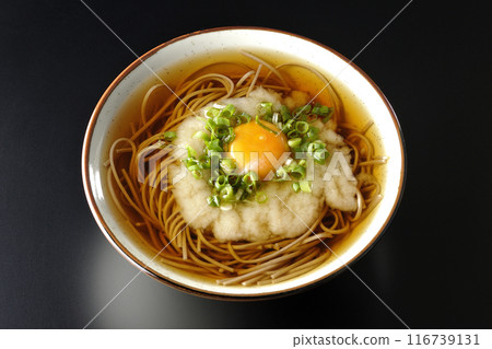 Aerial view of Tsukimi Tororo Soba noodles on a black background Aerial view of Tsukimi Tororo Soba noodles on a black background 116739131