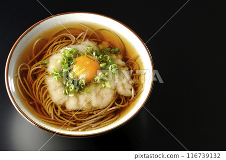 Aerial view of Tsukimi Tororo Soba noodles on a black background Aerial view of Tsukimi Tororo Soba noodles on a black background 116739132