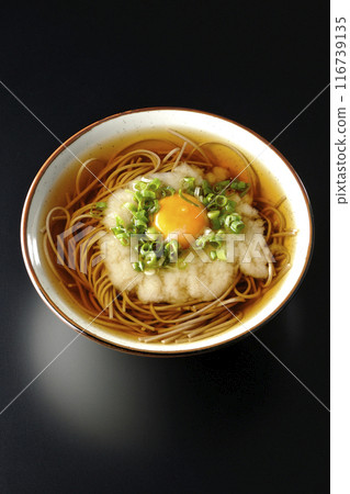 Aerial view of Tsukimi Tororo Soba noodles on a black background Aerial view of Tsukimi Tororo Soba noodles on a black background 116739135