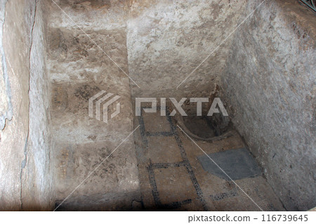 Basin feature alongside an ancient Mosaic in the basement of The Church of St. Joseph in Nazareth, Israel 116739645