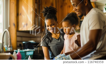 Dark-skinned young family in their home doing chores together 116740359