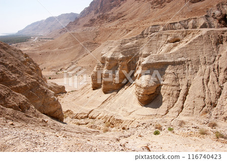 Archaeological site of Qumran where Dead Sea scrolls discovered in caves in cliffs, Judea Desert, Israel, Archaeological site of Qumran where Dead Sea scrolls discovered in caves in cliffs, Judea Desert, Israel, 116740423