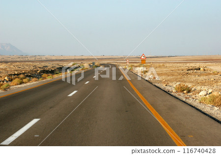 Famous road number 90, which crosses Israel from north to south in the Jordan Valley, near the Dead Sea, Israel 116740428