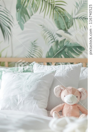 Cozy Bedroom Decor with Tropical Leaf Wallpaper and Plush Toy Cozy Bedroom Decor with Tropical Leaf Wallpaper and Plush Toy 116740525