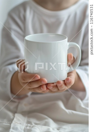 Close-up of Hands Holding a White Ceramic Mug with Coffee on a White Background Close-up of Hands Holding a White Ceramic Mug with Coffee on a White Background 116740531