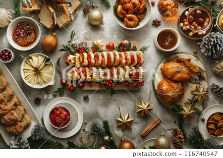 Festive Holiday Spread with Assorted Pastries, Fruits, and Christmas Decorations Festive Holiday Spread with Assorted Pastries, Fruits, and Christmas Decorations 116740547