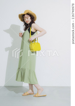 Young woman at summer resort 116740978