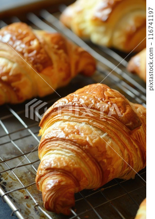 Fresh Pistachio Croissants on Parchment Paper - Gourmet Breakfast Pastries Fresh Pistachio Croissants on Parchment Paper - Gourmet Breakfast Pastries 116741197