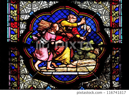 Isaac carrying the wood of the sacrife, prefiguration of the carrying of the Cross, stained glass window in the Basilica of Saint Clotilde in Paris, France Isaac carrying the wood of the sacrife, prefiguration of the carrying of the Cross, stained glass window in the Basilica of Saint Clotilde in Paris, France 116741817