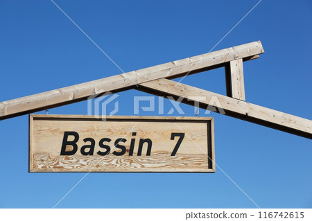 Bassin 7 sign on a signboard. Bassin 7 is the cultural and culinary district on Aarhus Island, Denmark Bassin 7 sign on a signboard. Bassin 7 is the cultural and culinary district on Aarhus Island, Denmark 116742615