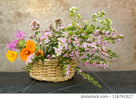 Fresh aromatic herbs in a basket on the stone. 116742827
