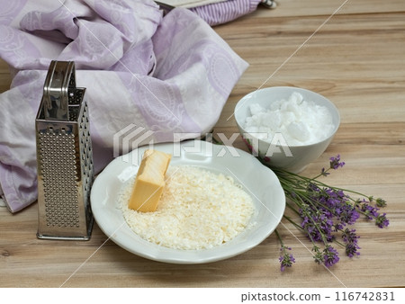 Ingredients for homemade laundry detergent made from grated soap, crystalline sodium and water. Ingredients for homemade laundry detergent made from grated soap, crystalline sodium and water. 116742831