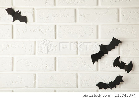 Flying black bats over white background, Halloween decoration concept. Flying black bats over white background, Halloween decoration concept. 116743374