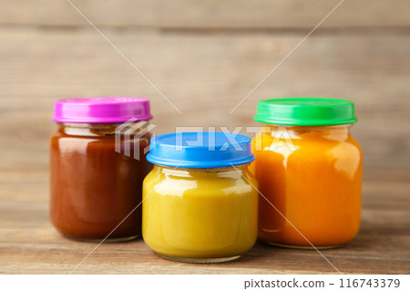 Jars of baby puree on grey background. Fruit and vegetables puree 116743379