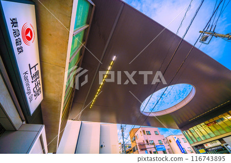 Tokyo cityscape in Japan: Tokyu Oimachi Line, Kaminoge Station, north exit (left) and main entrance (back right) seen on July 19th 116743895
