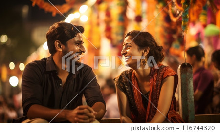 A couple immersed in a vibrant cultural festival, with colorful decorations and traditional costumes 116744320