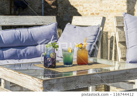 Vibrant Summer Cocktails on Rustic Patio Vibrant Summer Cocktails on Rustic Patio 116744412