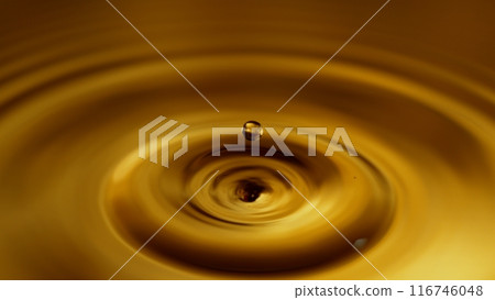 Super Slow Motion of Splashing Whiskey or Cider Drop, Filmed on High Speed Cinematic Camera at 1000 FPS 116746048