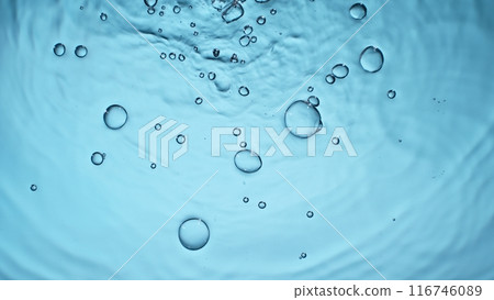 Freeze motion of splashing water drops on on light blue background Freeze motion of splashing water drops on on light blue background 116746089