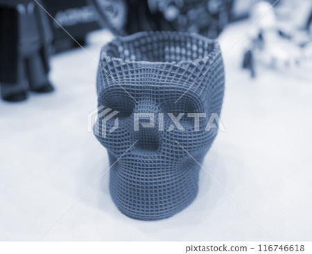 Prototype of human skull printed on 3D printer from molten purple plastic. Three-dimensional model skull 3D printed close-up. Additive progressive medical technology. Modern new printing manufacturing Prototype of human skull printed on 3D printer from molten purple plastic. Three-dimensional model skull 3D printed close-up. Additive progressive medical technology. Modern new printing manufacturing 116746618