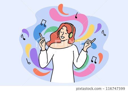 Happy woman music lover listens to music on headphones and energetically waves hands enjoying melody 116747399