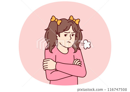 Angry little girl stands with arms crossed feeling hurt after being punished by kindergarten staff Angry little girl stands with arms crossed feeling hurt after being punished by kindergarten staff 116747508