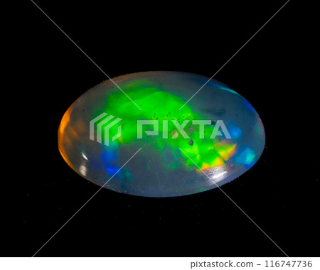 natural rainbow opal gem isolated on black background natural rainbow opal gem isolated on black background 116747736