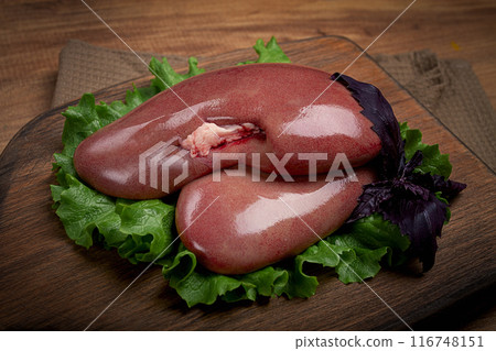 raw pork kidneys, on a chopping board, close-up, top view, no people, 116748151