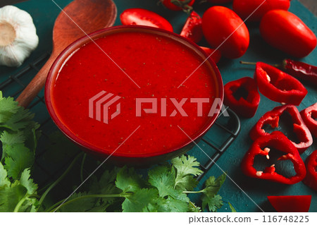 Tomato sauce, tomatoes and sweet pepper, Georgian Satsebeli sauce, with ingredients on a dark background, top view, close-up, no people, 116748225