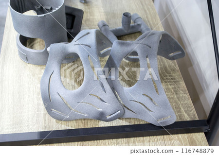 Object from powder plastic printed on 3D printer. Multi Jet Fusion MJF. Created model on industrial 3D printer from polyamide powder. Concept new modern innovation 3D printing technology 116748879