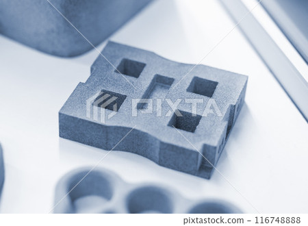 Object from powder plastic printed on 3D printer. Multi Jet Fusion MJF. Created model on industrial 3D printer from polyamide powder. Concept new modern innovation 3D printing technology Object from powder plastic printed on 3D printer. Multi Jet Fusion MJF. Created model on industrial 3D printer from polyamide powder. Concept new modern innovation 3D printing technology 116748888