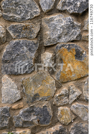 Stone wall as a background or texture. Part of a stone wall, for background or texture Stone wall as a background or texture. Part of a stone wall, for background or texture 116749730