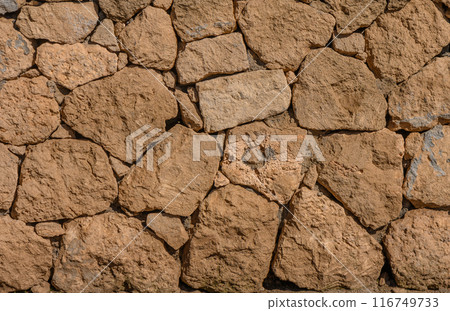 wall of clay bricks as background 1 116749733