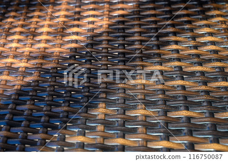 Weave rattan background. Woven product backdrop Weave rattan background. Woven product backdrop 116750087