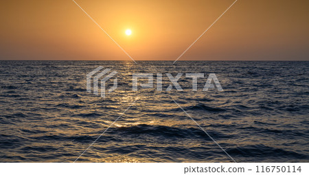 Dramatic sunset sky. Dramatic sunset over the sea 116750114
