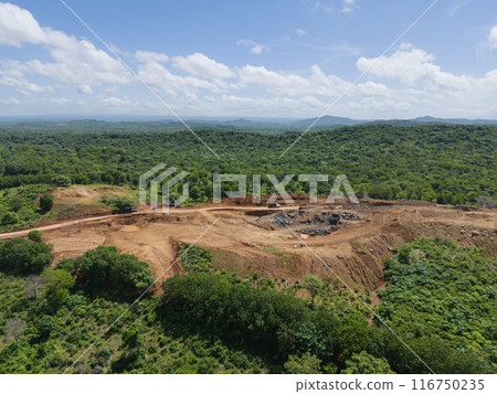 Wide mine quarry on green natural landscape Wide mine quarry on green natural landscape 116750235