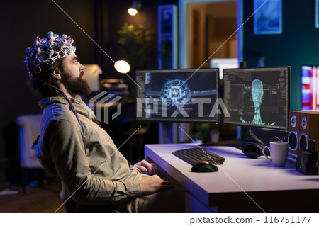 Computer engineer wearing EEG headset on head to communicate with artificial intelligence entity with anthropomorphic body. IT specialist using high tech gear to chat with AI robot in humanoid form 116751177