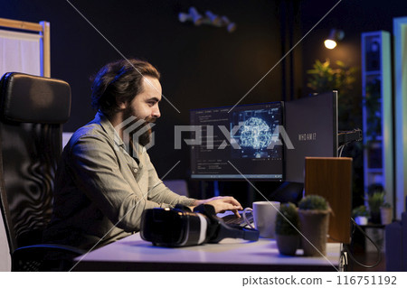 IT specialist smiling seeing AI becoming sentient, talking with him, asking questions. Computer engineer happy about artificial intelligence wishing to befriend humanity after becoming self aware 116751192