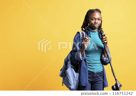 Portrait of african american motivational speaker talking in microphone, addressing audience, isolated over studio background. Expressive BIPOC lecturer using mic, inspiring motivation Portrait of african american motivational speaker talking in microphone, addressing audience, isolated over studio background. Expressive BIPOC lecturer using mic, inspiring motivation 116751242