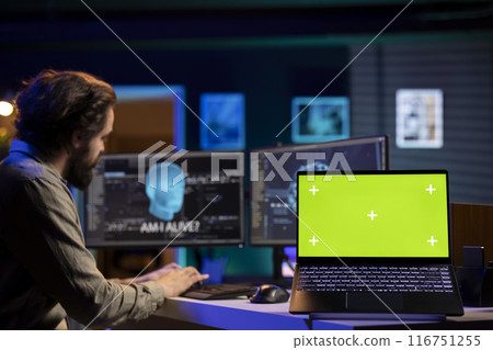 Programmer being asked existential questions by awaken AI gaining consciousness, green screen laptop. Man communicating with artificial intelligence emulating humans, mockup notebook Programmer being asked existential questions by awaken AI gaining consciousness, green screen laptop. Man communicating with artificial intelligence emulating humans, mockup notebook 116751255