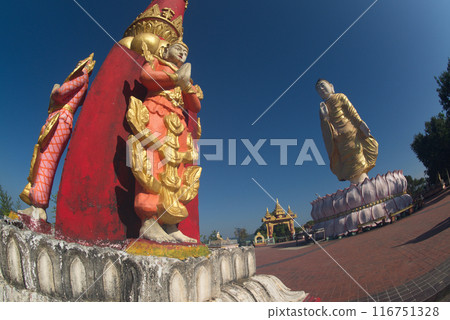 Pillars decorated with angelsTilawkasayambhu standing Buddha statue on top of hill for breathtaking views of the fishing boats and the Ngapali Bay. And it is also a famous viewpoint. Myanmar. 116751328
